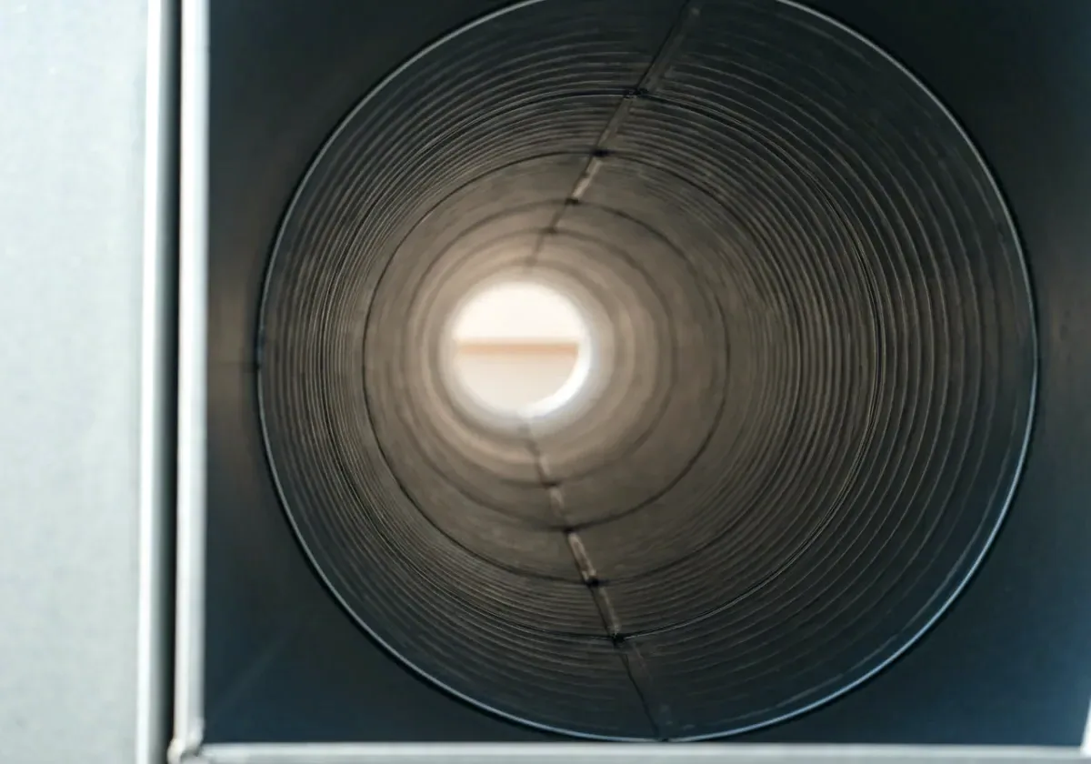After — air duct cleaning: Supply ducts furred with years of dust, cleaned so the air moves free again.