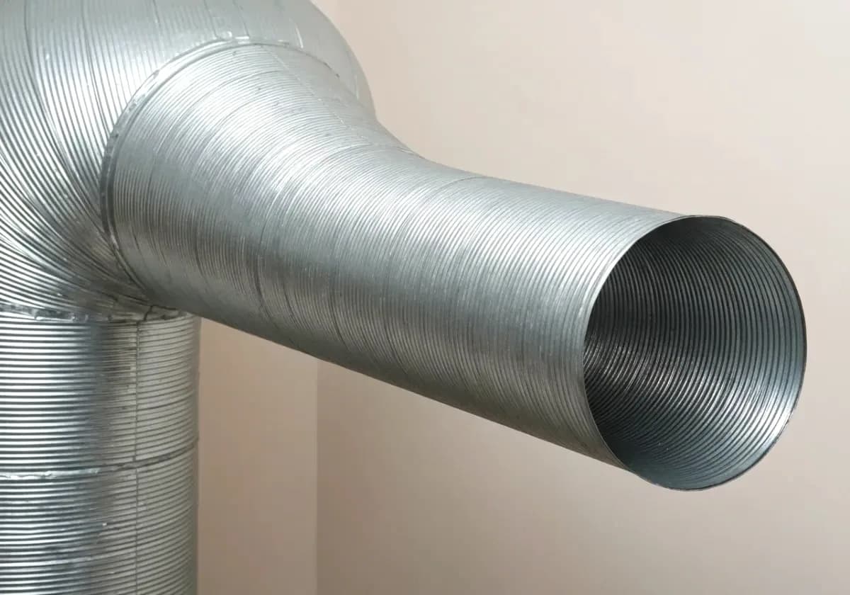After — dryer vent cleaning: A vent run packed solid with lint, opened back up to full airflow.