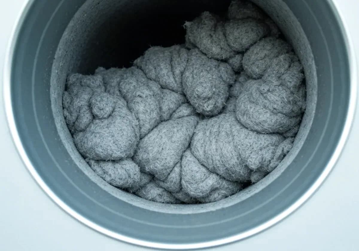 Before — dryer vent cleaning: A vent run packed solid with lint, opened back up to full airflow.